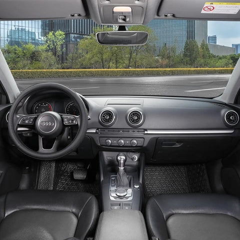 Interior view of a car showcasing a black microfiber steering wheel cover for comfort and grip.
