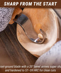 Right Handed Spoon Carving Hook Knife with ergonomic handle in wooden bowl, slick curved blade for kuksa cups and wooden bowls.