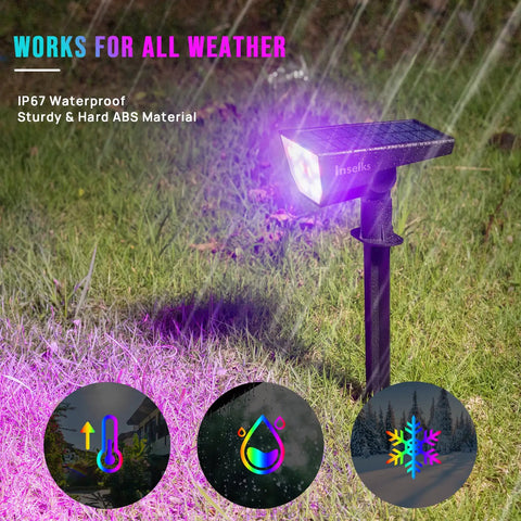 Solar Color Spotlight Lights Outdoor 35 LEDs Multicolor IP67 Waterproof 4 Pack illuminating grass with a purple glow.