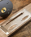 Cut The Headache And Nail Your Hang With This Picture Hanging Keyhole Routing Guide And Flush Mount Template Smooth Operator on a wooden surface.