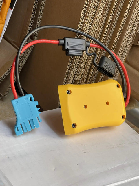 Plug And Play Battery Adapter For Dewalt 18V 20V To Peg Perego Ride On Toys with yellow casing and wire harness connector.