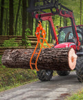 Orange VEVOR Timber Claw log grapple with four claws, side view attached to tractor loader lifting a thick log