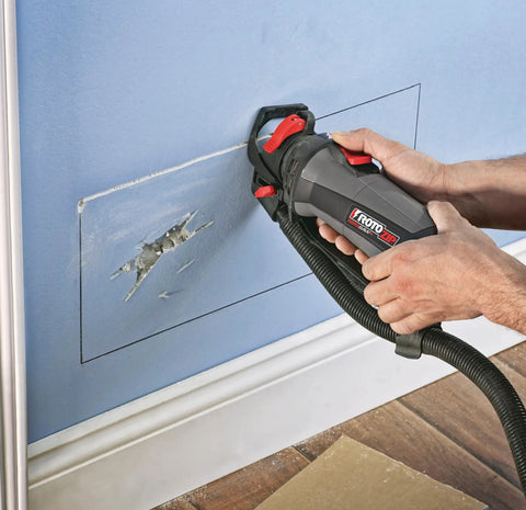 Person using Roto Zip GP16 One Eighth Inch Guide Point Drywall Cutting Zip Bit for Controlled Cuts in Drywall Up to One Inch Thick