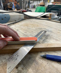 Using 9 Inch Savage T Bevel with stainless steel rule for precise angle measurement on wood