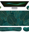 Ergonomic Large Mouse Pad And Keyboard Wrist Rest Dope Desk Pad For Keyboard And Mouse 4 In 1 Extended Gaming Desk Mat With Wrist Support For Home Office Study Green Leaves, featuring green leaf pattern, shown with monitor and accessories.