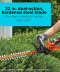 Person using a 22 Inch Electric Hedge Trimmer with Dual Action Blades and Full Wraparound Handle on green shrubs