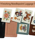 Four Pack No Fuss Needlepoint Luggage Tags Featuring Slick Faux Leather Shell And Crystal Clear Id Window displaying colorful stitched designs.