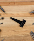 Beefy Heavy Duty T Shape Strap Hinges Set Zinc Alloy Construction Corrosion Resistant with tools on wooden surface