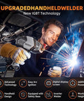 Man using Portable 110V Arc Welder With IGBT Inverter Five Adjustable Current Settings For 3/32 To 1/8 Inch Rods indoors