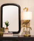 Whimsical Resin Flamingo Table Lamp With Linen Shade In Gold Finish, 32 Inches Tall, Inline Switch, displayed by a mirror