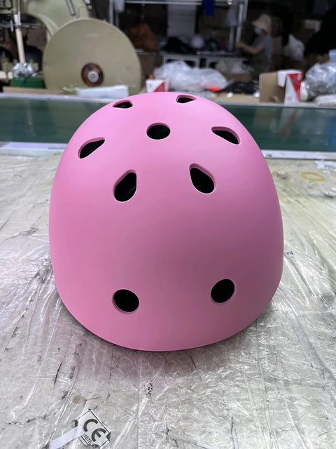 Pink adjustable kids helmet for skating, biking, cycling, and skateboarding, ABS shell with vents, part of protective set