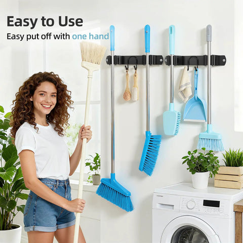 Stainless Steel Broom Holder Wall Mount 2 Pack Heavy Duty Mop Organizer With 2 Slots And 2 Hooks installed in laundry room