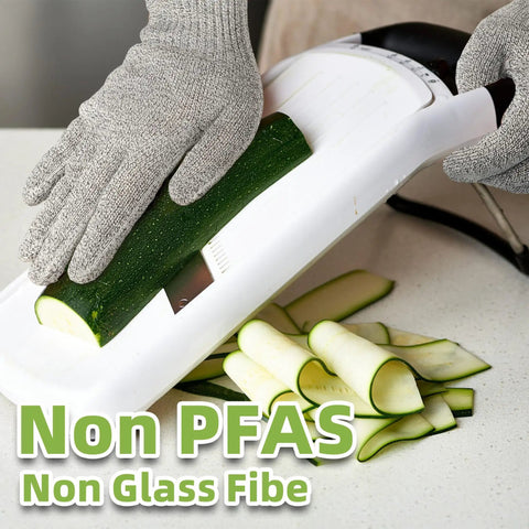Person using Pro Grade ANSI Cut Resistant Food Grade Gloves For Kitchen Prep And Meat Cutting Oyster Shucking And Fish Fillet Mandoline Safety Gear With Ultra Strong Fibers And Stainless Steel For Heavy Duty Home Or Pro Use while slicing zucchini on a mandoline.