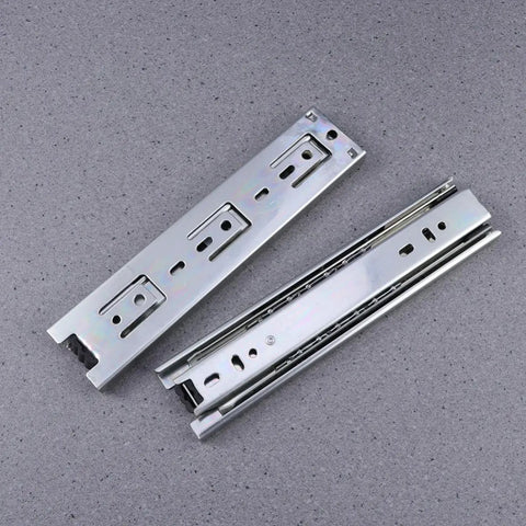 Rock Solid Steel Ball Bearing Drawer Slide Silent Telescopic Rail With Slick Glide Action Heavy Duty Cabinet Runner Pair on grey surface.