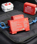 Automatic Car Fire Extinguisher Compact Aerosol Unit With Slick Peel Stick Install For Instant Flame Stop and Solid Vehicle Safety on black surface.