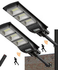 Beefed Up 2000W Solar LED Street Light with 60,000LM, motion sensor, dusk till dawn, mounted on pole, remote control visible