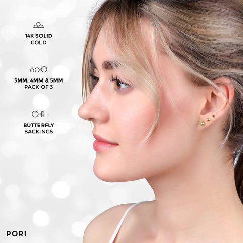 14K Solid Gold Ball Stud Earrings Three Pair Pack With 3mm 4mm And 5mm Sizes Yellow Color Finish And Butterfly Backings Great For Sensitive Ears Everyday Wear And Sparkle on model
