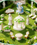 15 Pcs Mini Garden Furniture Ornaments Set For Do It Yourself Fairy Garden And Micro Landscape Decor Totally Durable Resin Patio Table Chair Bench Arch Fountain Statues Set displayed outdoors