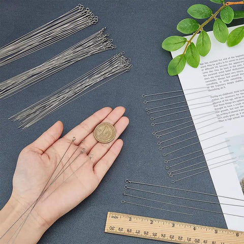 120 Stainless Steel Wire Spinner Shafts For Fishing Lures, 4 Styles, 8.7 To 16 Cm shown with ruler and hand for scale.