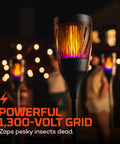 Outdoor Solar Torch Zapper Bug Light With Warm Tiki Torch Ambience Solar Powered And Rechargeable Battery Keeps Mosquitoes Flies And Gnats Away Three Light Modes For All Night Yard Vibes, glowing in a dark outdoor setting.