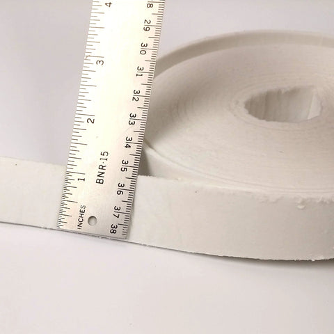 White ceramic fiber gasket strip roll, 1 in wide, 1/8 in thick, 200 in long, side view with ruler