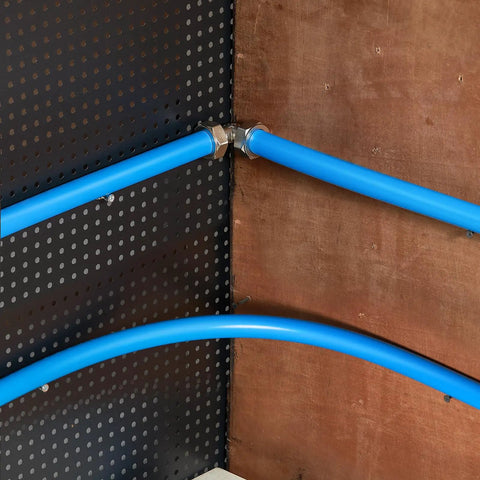 Installed Heavy Duty Pro Grade 300 Foot Air Compressor Line Kit With Three Quarter Inch HDPE Aluminum HDPE Three Layer Tubing for garages.