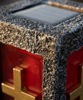 Close-up of Blue Cemetery Light with textured surface and gold cross detail on anodized aluminum, for grave markers and memorials