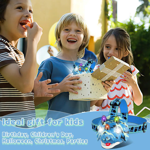 Children holding a gift box with Dino Themed LED Headlamp For Kids And Adults With Four Modes Hands Free Dino Headlamp visible.
