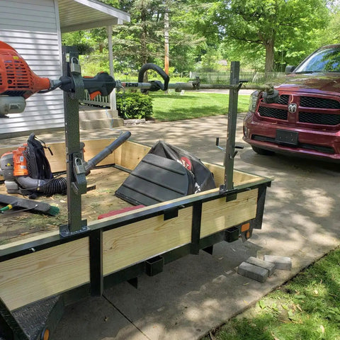 2 Place Locking Trimmer Rack For Open Landscape Trailers Heavy Duty Steel Weed Eater Holder mounted on trailer