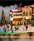 Miniature Christmas village scene with illuminated buildings and figures, featuring holiday decorations and snow-covered landscape