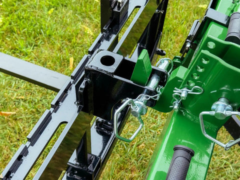 Close-up of Dual Mount Tractor Pallet Forks For Front End Loader And 3 Point Hitch With 2 Inch Receiver Chain Hooks Weight Rack