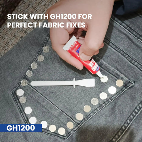 Person applying GH1200 glue to fabric with rhinestones, showcasing Permanent Fabric Glue For Clothes And Crafts That Binds Strong.