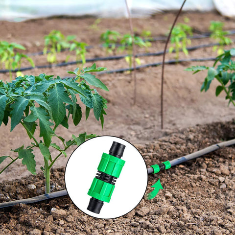 Drip irrigation coupling, green 5/8-inch universal connector on black tubing in garden bed; close-up inset.