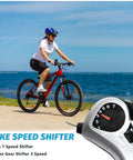 Cyclist on red bike using 7 Speed Thumb Shifter Set For Bikes, Left 3 Speed Front And Right 7 Speed Rear, TX50-7 Lever Pair.
