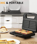 Three In One Sandwich And Waffle Maker With Removable Plates Panini Press Nonstick Plates Indicator Lights And Cool Touch Handle 750W Black Kitchen Gadget For Grab And Go Breakfasts And Tasty Snacks open with waffles and sandwiches on a kitchen counter