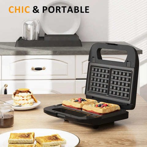 Three In One Sandwich And Waffle Maker With Removable Plates Panini Press Nonstick Plates Indicator Lights And Cool Touch Handle 750W Black Kitchen Gadget For Grab And Go Breakfasts And Tasty Snacks open with waffles and sandwiches on a kitchen counter