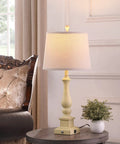 Three Way Dimmable Touch Control Table Lamp on a round side table with USB charging port and farmhouse linen drum shade.