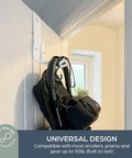 Over The Door Stroller Hanger No Drill Heavy Duty Metal Holds 50 Lb Adjustable Arms hanging black stroller in hallway
