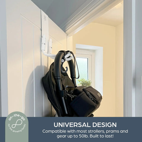 Over The Door Stroller Hanger No Drill Heavy Duty Metal Holds 50 Lb Adjustable Arms hanging black stroller in hallway