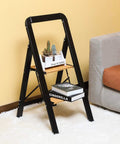 Two Step Folding Aluminum Stool With Wood Grain Finish Anti Slip Design Portable Collapsible Ladder in room next to a couch