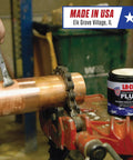 Person applying Water Soluble Copper Flux Paste For Soldering, All Weather Plumbing Grade, Brush In Cap, 4 Oz, Non Toxic, Lead Free