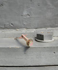 Heavy Duty Metal Shear Pins With Locking Mechanism For Ceiling Fan Pulley and Receiver Trailer Hitches on gray surface.
