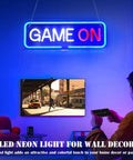 Lit Gaming Neon Sign Light For Bedroom Decor LED neon art in blue and red GAME ON text glowing above a gamer holding a controller