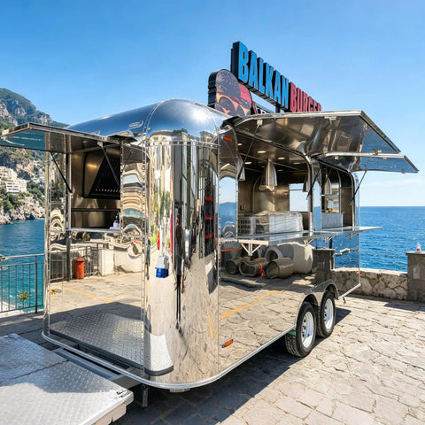 Kickass 10 Foot Stainless Steel Food Trailer Rocking A Slick Mirror Exterior And Completely Loaded Mobile Catering Kitchen by the seaside.