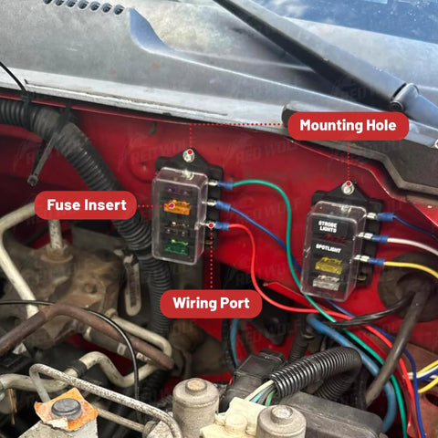 Heavy Duty 4 Way Blade Fuse Block With Slick Damp Proof Cover For Plug And Play Auto Marine Rv Truck Wiring Power Distribution Panel 10 To 32 V Dc Setup mounted in vehicle with visible wiring ports and fuse insert.