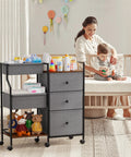Three Tier Rolling Diaper Caddy Organizer With Dividers And Drawers For Nursery Use next to mother and baby in nursery room.