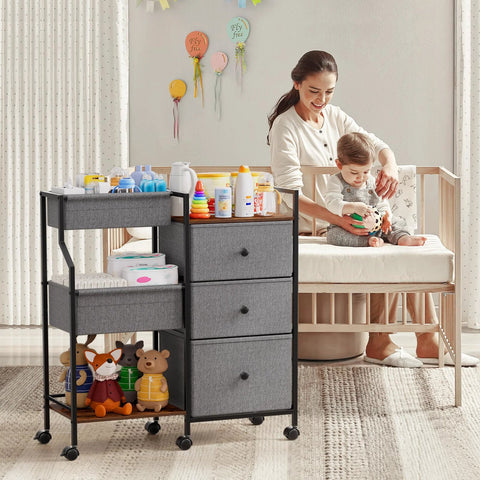 Three Tier Rolling Diaper Caddy Organizer With Dividers And Drawers For Nursery Use next to mother and baby in nursery room.