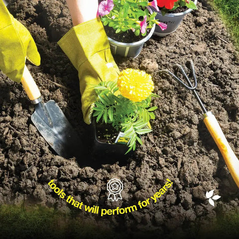Gardener using 10 Piece Garden Tools Set with heavy duty hand tools and ergonomic handles planting flowers, visible trowel and fork.