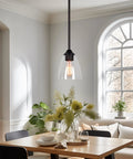 Clear Glass Lamp Shades 3-Pack Modern Cone Shape 6x5.75 Inch 1-5/8 Inch Fitter in a kitchen dining area fixture.