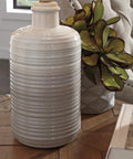 Two Pack Neutral Ceramic Table Lamps, 25.5 Inch Tall with Taupe Glazed Bases and Textured Drum Shade on wooden table